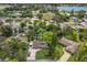 An aerial view of a home with mature landscaping, a lengthy drive and nearby views of the lake at 4619 20Th W Ave, Bradenton, FL 34209