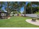 An idyllic backyard featuring a cozy gazebo, colorful kayaks and a inviting fire pit for relaxation and entertainment at 4619 20Th W Ave, Bradenton, FL 34209