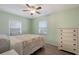Serene bedroom featuring wood-look floors, bright green walls, and a comfortable bed at 4619 20Th W Ave, Bradenton, FL 34209