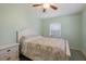 Inviting bedroom with a comfortable bed, light green walls, and wood-look floors at 4619 20Th W Ave, Bradenton, FL 34209