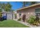 This home exterior showcases well-maintained landscaping and a practical storage shed at 4619 20Th W Ave, Bradenton, FL 34209