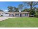 A well-kept single-story home featuring a lush green lawn and fresh exterior paint at 4619 20Th W Ave, Bradenton, FL 34209