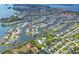 Expansive aerial view showcases a waterfront community with winding canals and numerous homes with boat docks at 4704 Coral Lake Dr, Bradenton, FL 34210