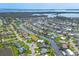Expansive aerial showcasing the waterfront homes and canal system, lush greenery, and a coastal charm, perfect for boating enthusiasts at 4704 Coral Lake Dr, Bradenton, FL 34210