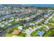 Panoramic aerial view highlighting the waterfront homes along a winding canal, lush tropical foliage, and the beauty of coastal living at 4704 Coral Lake Dr, Bradenton, FL 34210