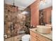 Bathroom with a walk-in shower, vessel sink, and granite countertops at 4704 Coral Lake Dr, Bradenton, FL 34210