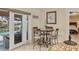 Breakfast nook next to a sliding glass door with views of the pool and outdoor area at 4704 Coral Lake Dr, Bradenton, FL 34210