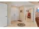 A spacious foyer features tile flooring and double-door entry, leading to other rooms at 4704 Coral Lake Dr, Bradenton, FL 34210
