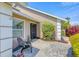 Paver entry, neutral paint, and green shrubbery make for a well-kept exterior at 4704 Coral Lake Dr, Bradenton, FL 34210