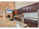 Open kitchen features granite countertops, stainless steel appliances, ample cabinet space, and modern lighting at 4704 Coral Lake Dr, Bradenton, FL 34210