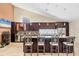 Spacious kitchen boasts a large island with bar seating, stainless steel appliances, and modern lighting at 4704 Coral Lake Dr, Bradenton, FL 34210