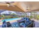 Screened lanai with pool views and comfortable seating at 4704 Coral Lake Dr, Bradenton, FL 34210