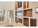 Open living room features a fireplace, entertainment center and neutral colored walls at 4704 Coral Lake Dr, Bradenton, FL 34210