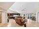 An open floor plan provides views of the kitchen and patio through the sliding glass doors at 4704 Coral Lake Dr, Bradenton, FL 34210