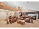 Open-concept living room features high ceilings, travertine floors, and connects to the modern kitchen at 4704 Coral Lake Dr, Bradenton, FL 34210