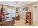 Home office with a large window, desk and comfortable chair at 4704 Coral Lake Dr, Bradenton, FL 34210