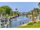 Beautiful canal view highlighting waterfront living, boat docks and lush landscaping, capturing the essence of a serene waterway lifestyle at 4704 Coral Lake Dr, Bradenton, FL 34210