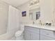 Well-lit bathroom featuring a tub-shower combination, vanity, and modern decor at 5816 Helicon Pl, Sarasota, FL 34238