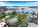 Beautiful waterfront home with a private pool and dock, surrounded by lush greenery and serene canals at 600 De Narvaez Dr, Longboat Key, FL 34228