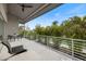 Outdoor balcony offers great views of lush trees and the gorgeous blue sky at 600 De Narvaez Dr, Longboat Key, FL 34228