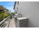 This modern home features an outdoor grill and spacious balcony with room for entertaining at 600 De Narvaez Dr, Longboat Key, FL 34228