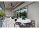Bright balcony with comfortable seating, lovely landscaping, and lots of fresh air at 600 De Narvaez Dr, Longboat Key, FL 34228