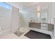 Contemporary bathroom featuring a glass shower, double vanity with modern fixtures and stylish wall lighting at 600 De Narvaez Dr, Longboat Key, FL 34228
