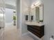 Contemporary bathroom features a floating vanity and an elegant vessel sink at 600 De Narvaez Dr, Longboat Key, FL 34228