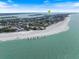 Panoramic aerial view of a stunning beach with soft sand and clear turquoise water, ideal for relaxation and recreation at 600 De Narvaez Dr, Longboat Key, FL 34228
