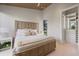 Light and airy bedroom featuring a unique wooden bed frame and an organized walk-in closet at 600 De Narvaez Dr, Longboat Key, FL 34228