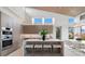 Modern kitchen with a large center island, stainless steel appliances, and stylish bar stool seating at 600 De Narvaez Dr, Longboat Key, FL 34228