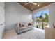 Cozy living room with vaulted wood ceiling, a comfortable sofa, and a large window with a green outdoor view at 600 De Narvaez Dr, Longboat Key, FL 34228
