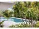 Enjoy relaxing by the pool surrounded by lush tropical landscaping for privacy at 600 De Narvaez Dr, Longboat Key, FL 34228