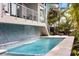 This luxury home features a beautifully designed pool with a waterfall feature at 600 De Narvaez Dr, Longboat Key, FL 34228