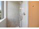 Shower boasts pebble accent wall, glass door, and brushed nickel fixtures at 600 De Narvaez Dr, Longboat Key, FL 34228