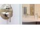 Shower detail showcases brushed nickel fixtures and modern subway tile at 600 De Narvaez Dr, Longboat Key, FL 34228