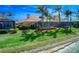 Picturesque backyard with mature landscaping and a screened lanai, ideal for relaxing by the waterfront at 6605 Waters Edge Way, Lakewood Ranch, FL 34202
