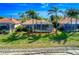 Backyard view featuring a screened lanai and mature landscaping, providing a private outdoor retreat at 6605 Waters Edge Way, Lakewood Ranch, FL 34202