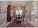 Elegant dining room featuring a chandelier, stylish rug, and built-in display cabinet at 6605 Waters Edge Way, Lakewood Ranch, FL 34202