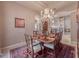 Dining area with chandelier and archway views to the living room and kitchen at 6605 Waters Edge Way, Lakewood Ranch, FL 34202