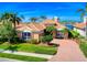 Desirable single-story home with lush front yard and convenient brick driveway at 6605 Waters Edge Way, Lakewood Ranch, FL 34202
