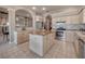 Kitchen featuring an island and lots of cabinets, offering great storage and countertop workspace for cooking and prepping at 6605 Waters Edge Way, Lakewood Ranch, FL 34202