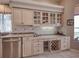 Kitchen featuring granite countertops, stainless steel appliances, and custom wine storage at 6605 Waters Edge Way, Lakewood Ranch, FL 34202