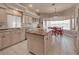 A gourmet kitchen with a central island flows into the dining area, perfect for entertaining and Gathering meals at 6605 Waters Edge Way, Lakewood Ranch, FL 34202