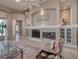 Inviting living room with a fireplace, built-in shelving, and neutral decor at 6605 Waters Edge Way, Lakewood Ranch, FL 34202