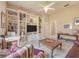 Cozy living room featuring custom built-in shelving and a comfortable seating area at 6605 Waters Edge Way, Lakewood Ranch, FL 34202