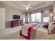 Spacious main bedroom with a ceiling fan and view to the outside at 6605 Waters Edge Way, Lakewood Ranch, FL 34202