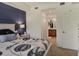 Comfortable bedroom featuring a blue accent wall and stylish bedding at 6611 Grand Estuary Trl # 105, Bradenton, FL 34212