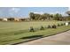 Well manicured driving range is available with a backdrop of palm trees and other greenery at 6611 Grand Estuary Trl # 105, Bradenton, FL 34212