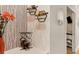 Hallway leading to a home office with wine rack at 6611 Grand Estuary Trl # 105, Bradenton, FL 34212